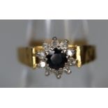 18ct gold sapphire and diamond cluster ring. Ring size N. Approx weight 5.6 grams. (B.P. 21% + VAT)