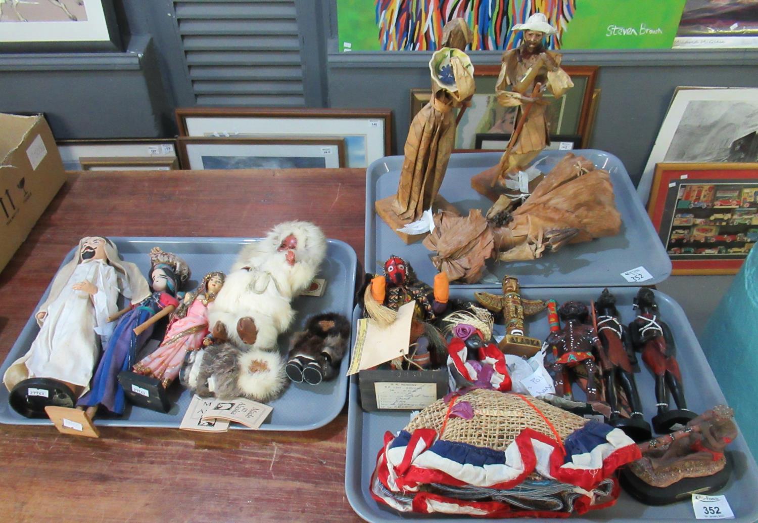 Three trays of International collectors dolls to include: carved Africa figures, Aboriginal