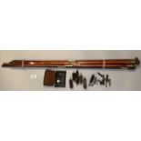 Collection of assorted hardwood shotgun cleaning rods with brass fittings, mops, jags and brushes,