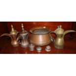 Collection of Middle Eastern copper and brass items to include; three Dallahs, large beaten copper