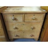 Small Victorian pine straight front chest of two short and two long drawers, on baluster turned