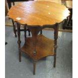 Early 20th Century oak lamp or occasional table, the carved top above turned legs and under-tier,