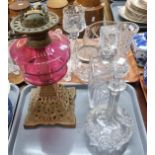 Tray containing two cut glass decanters and stoppers, one square, the other baluster shaped,
