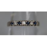 18ct white gold sapphire and diamond half eternity ring. Ring size O. Approx weight 2.2 grams. (B.P.