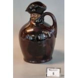 Royal Doulton brown glazed series ware single handled decanter modelled as an old man with moulded