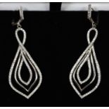 A pair of silver and white stone drop earrings. (B.P. 21% + VAT)