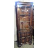 Reproduction Rackstraw, Droitwich, England, oak freestanding corner cabinet with brass 'H'