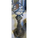 Metal armillary sundial sphere garden ornament on a composite baluster pedestal