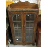 Early 20th Century oak two door, lead glazed, free standing bookcase. (B.P. 21% + VAT)