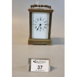French style brass carriage clock with full depth Roman enamel face and with key. (B.P. 21% + VAT)