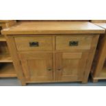 Good quality modern oak sideboard, the moulded top above two drawers and two blind panelled doors