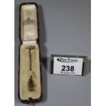 Three stone diamond stick pin of old cut diamonds in milligrain setting. In James Walker Ltd box. (