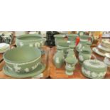 Two trays of green Wedgwood Jasperware to include; various vases, miniature urn, trinket box, jug,