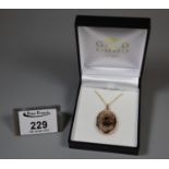 9ct gold engraved locket on chain. Approx weight 4.7 grams. (B.P. 21% + VAT)