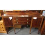 Edwardian mahogany inlaid bow front side board, standing on tapering legs and spade feet. (B.P.