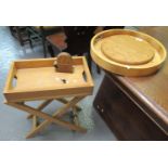 Modern small oak two handled tray on folding stand, together with biscuits, digestive tray, coasters