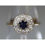 18ct gold sapphire and diamond cluster ring. Ring size I&1/2. Approx weight 2.4 grams. (B.P. 21% +