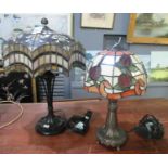 Two modern Tiffany style lamps with moulded Art Nouveau style bases and multi-coloured shades. (