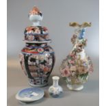 Japanese Imari fluted baluster shaped jar and cover, a German porcelain floral encrusted baluster