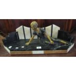 Art Deco style spelter figure of a seated lady on a veined marble geometric base, appearing