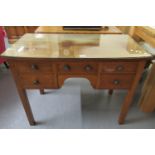 19th Century mahogany desk, the moulded bow front top above an arrangement of five drawers, standing