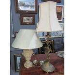 Two table lamps; one with metal foliate design base and fabric shade and the other with a