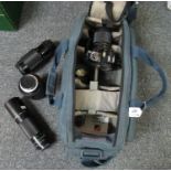 Canvas camera bag containing a Canon A1 SLR camera with autozoom lens, a Canon 300mm lens, Canon