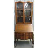 Early 20th century oak French style serpentine two stage bureaux bookcase. 75 x 50 x 200 approx. (