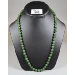 A string of jade beads. (B.P. 21% + VAT)