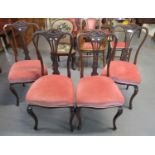 Set of four late Edwardian mahogany dining chairs with shaped and carved back, stuffover seats,