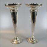 Pair of electroplated trumpet shaped vases with card cut rims and stepped circular bases. 31cm