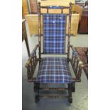 Early 20th century American spring rocking arm chair, later upholstered with tartan designs. (B.P.