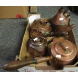 Box containing a set of three lidded copper cider measures with turned wooden handles and a copper