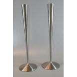 Pair of Robert Welch stainless steel, trumpet shaped candle sticks with circular domed and loaded