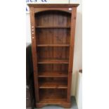 Modern pine six tier bookcase of narrow proportions with reeded designs. (B.P. 21% + VAT)
