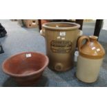 A small terracotta dairy pan, together with a two tone single handled stoneware flagon marked '