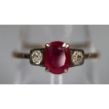 18ct gold ruby and diamond three stone ring. Ring size O & 1/2. Approx weight 1.8 grams. (B.P. 21% +