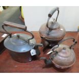 Three vintage copper kettles, one with iron handle. (3) (B.P. 21% + VAT)