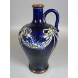 Early 20th Century Royal Doulton stoneware single handled jug on a blue ground with moulded swag,