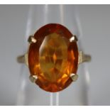 9ct gold ring set with an oval orange gemstone. Ring size L. Approx weight 3.7 grams. (B.P. 21% +