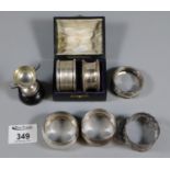 Bag of silver items to include five napkin rings (1.8oz troy approx), miniature silver two-handled