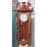 Early 20th century walnut Vienna type two train wall clock with key, pendulum, and weights. (B.P.