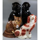 Pair of large Staffordshire pottery black ground and gilded fireside seated Spaniels, together