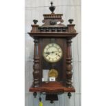 Early 20th century walnut two-train Vienna type wall clock with key and pendulum. (B.P. 21% + VAT)