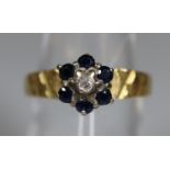 18ct gold sapphire and diamond cluster ring with engraved band. Ring size O. Approx weight 2.8