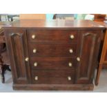 Early 20th century oak chest/sideboard with an arrangement of four straight front drawers flanked by