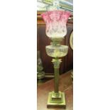 Early 20th Century double oil lamp having clear glass chimney, cranberry frosted and etched glass