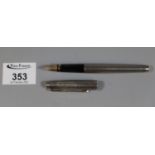 Parker silver engine turned fountain pen with 14ct nib. (B.P. 21% + VAT) Obvious dents to body and