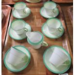 Tray with six Shelley fine bone china cups and saucers, together with a milk jug, decorated in white