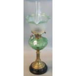 Early 20th Century double oil lamp having clear glass chimney, green and frosted etched glass shade,